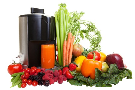 juicing machine with fruits and vegetables
