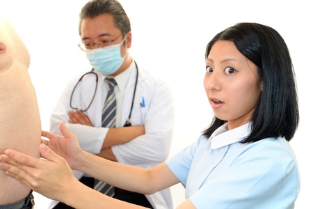 medical persons attending to an obese patient