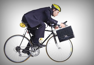 an office man riding a bike to work