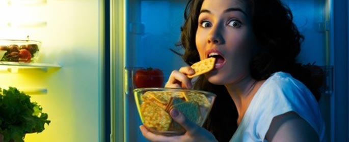 a lady snacking at late night