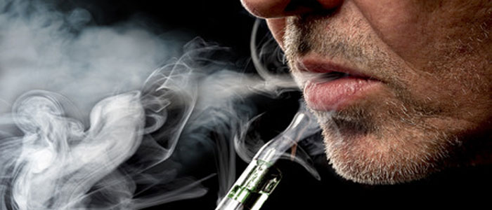 man smoking e-cigarettes