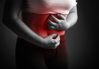 woman with chrons disease cramping in pain