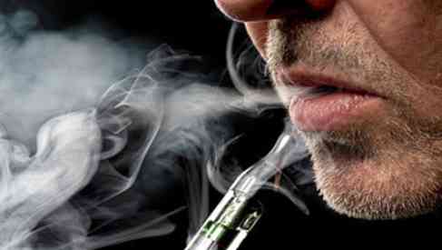 man smoking e-cigarettes